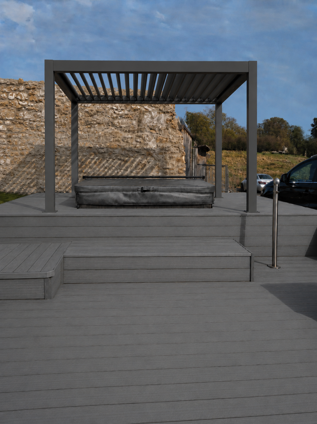 Grey composite lodge decking with hot tub platform and modern pergola